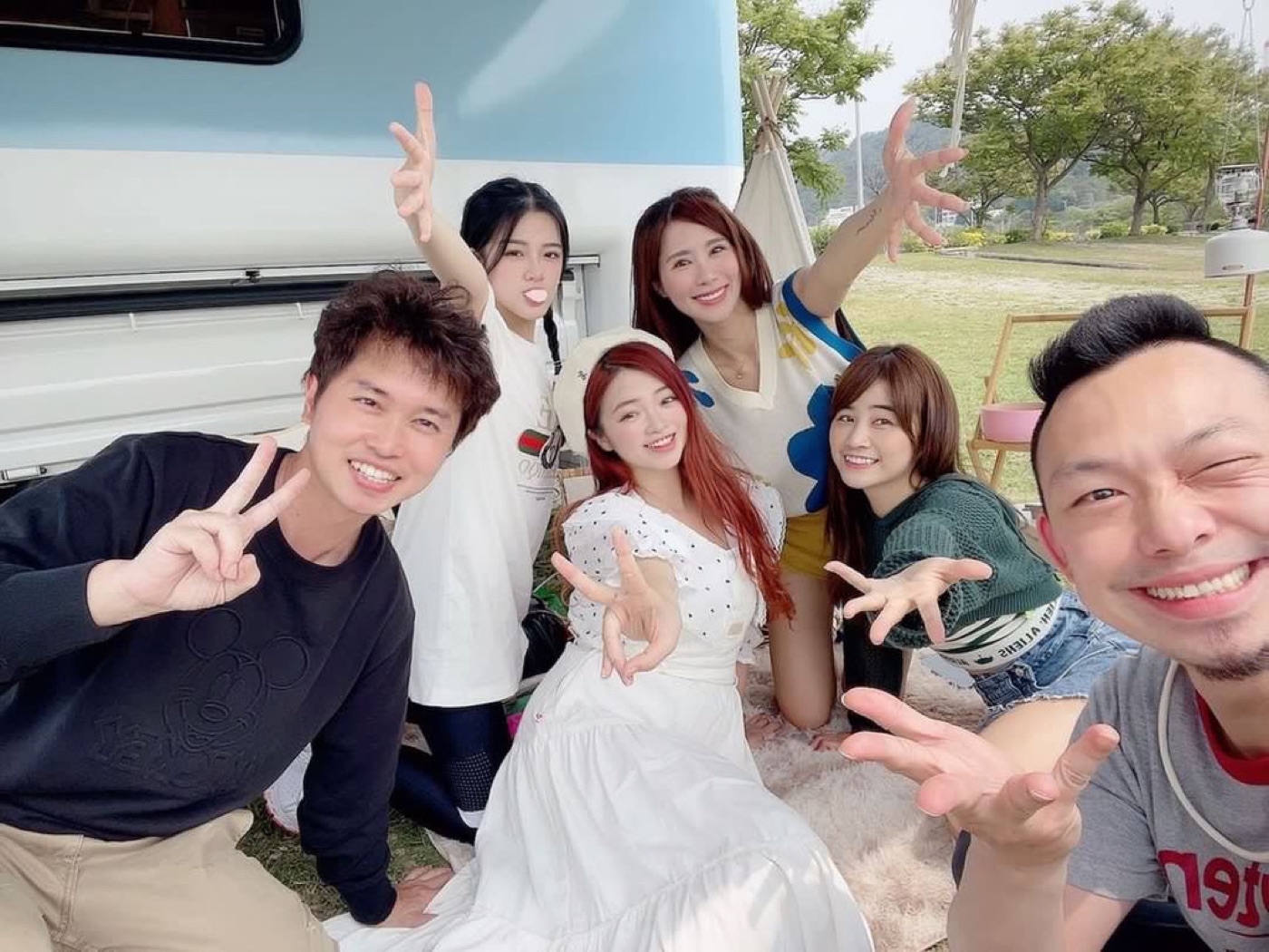 Sunny Taoyuan camp, travelers happy group photo before blue-white campervan—Rakuten Girls aesthetic camping birthday trip